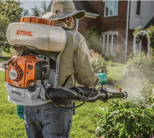 SSMC technician applying organic mosquito and tick treatment